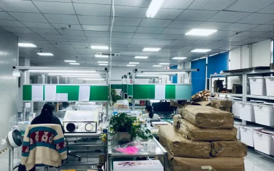 Modern aligner production lab with technicians assembling and packaging aligners in China.