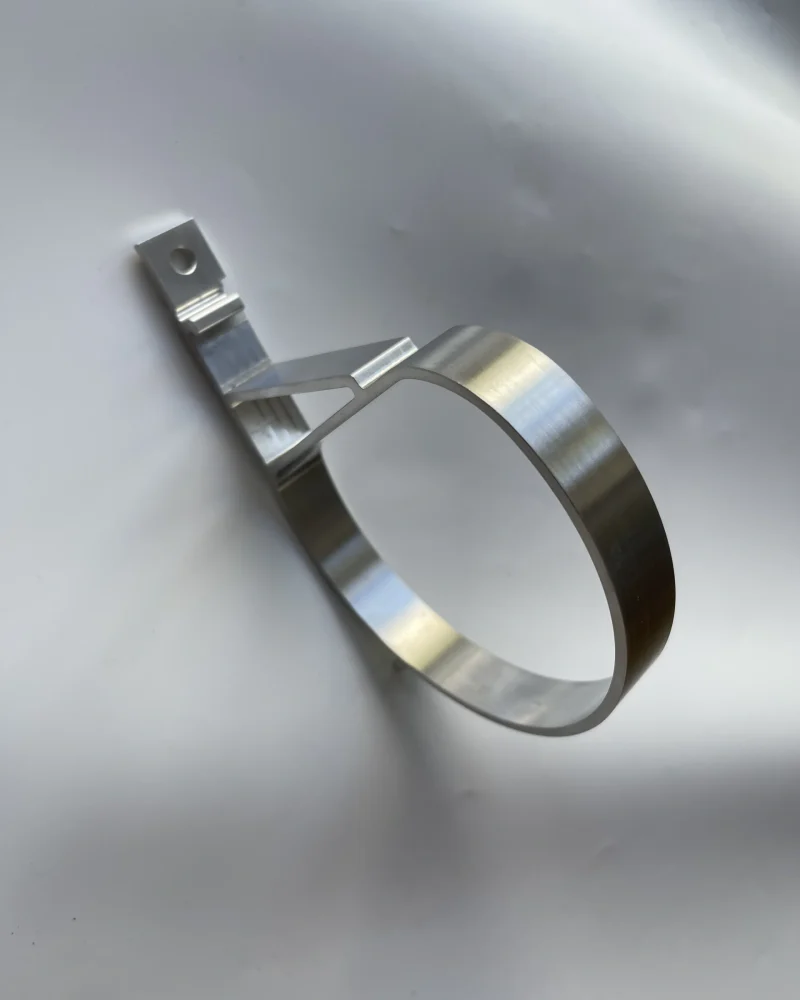 Custom support clamp made from stainless steel, ideal for secure fittings and pipe support.