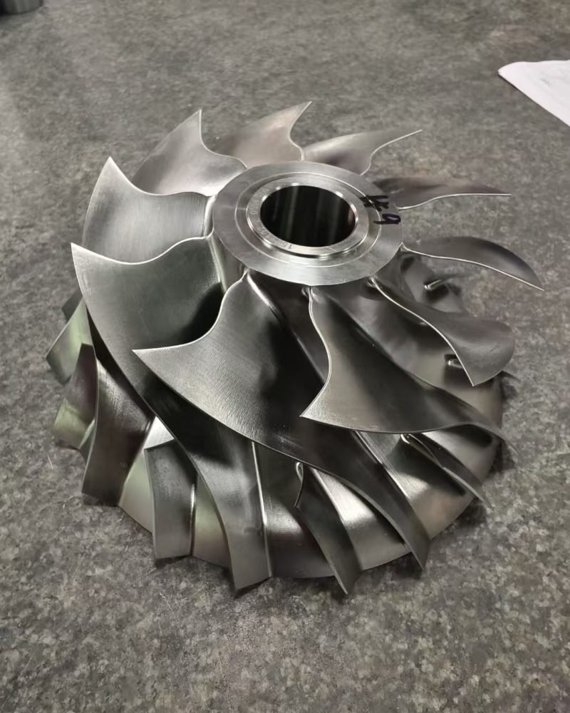 High-performance turbo impeller milled from aluminum, used in high-speed rotation systems.
